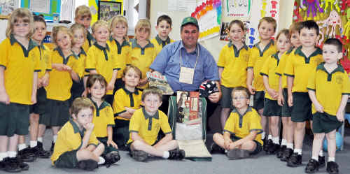 Father Jamie Collins is surrounded by St Mary’s School prep pupils’ well-wishes. Father Jamie Collins is surrounded by St Mary’s School prep pupils’ well-wishes.